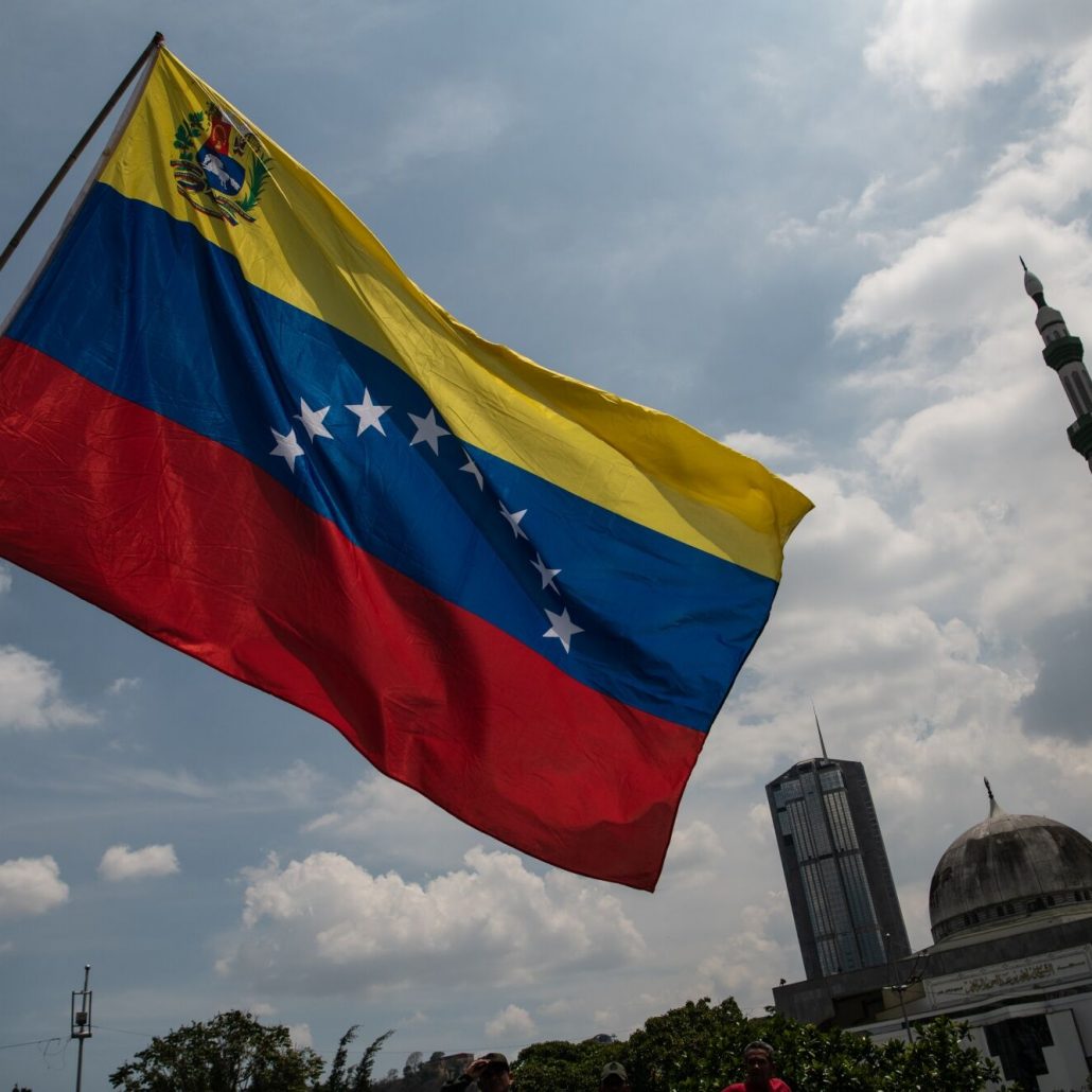 The Venezuela's flag during a march on the anniversary of a failed coup attempt against the late Hugo Chavez in Caracas, Venezuela, on Thursday, April 13, 2023. President Maduro gathered Venezuelans to celebrate the failed coup attempt in April 2002 that saw then-president of Venezuela, Hugo Chavez, ousted from office for 47 hours before being restored to power. Photographer: Carlos Becerra/Bloomberg